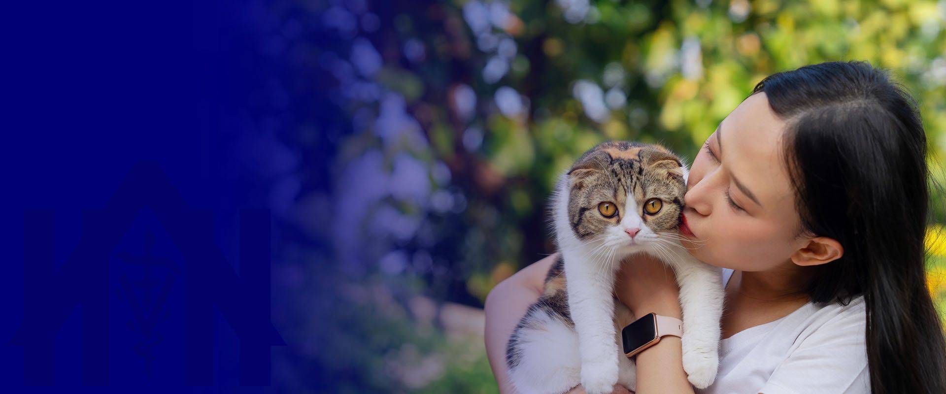 asian woman kissing her cat